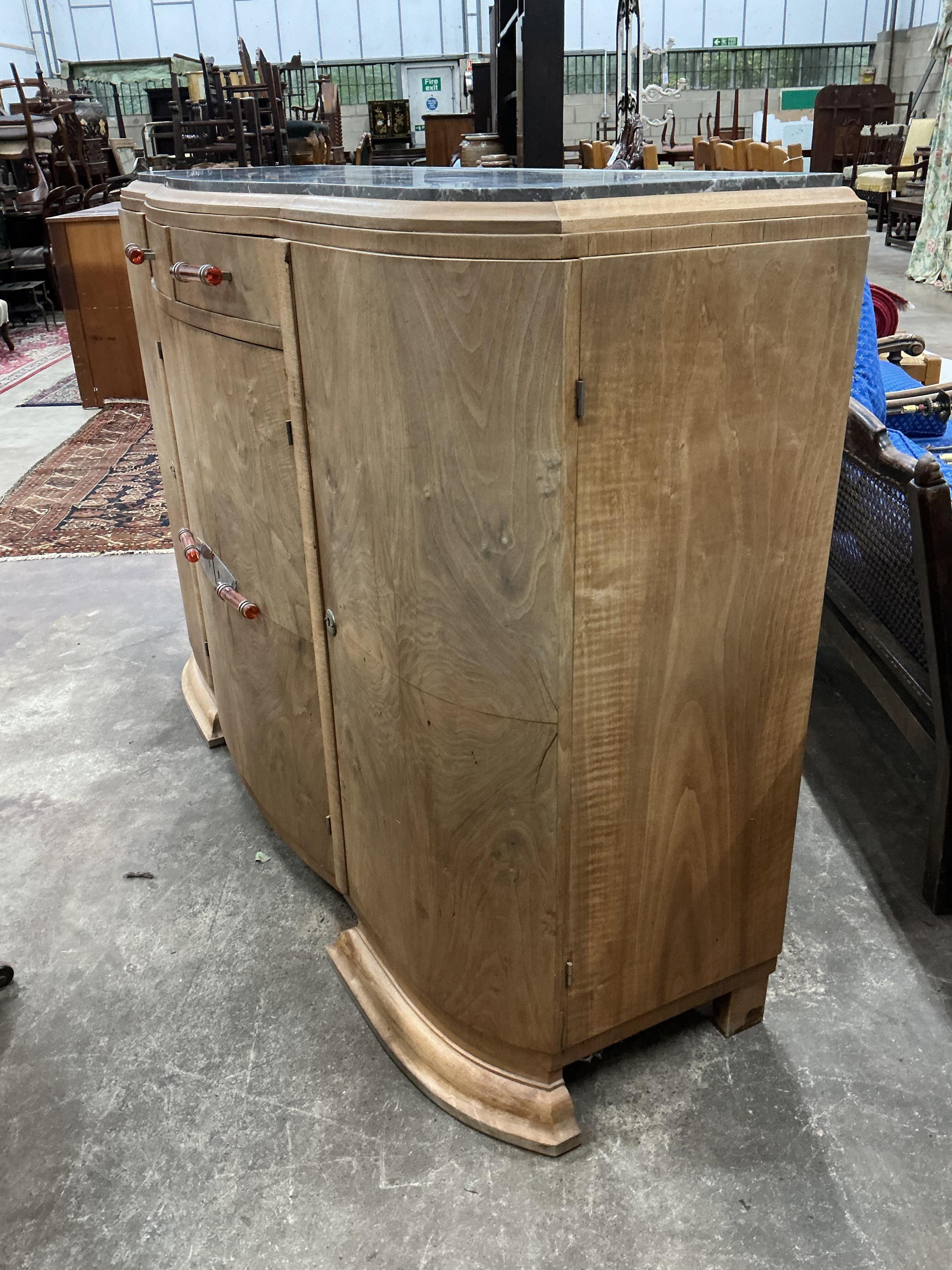 An Art Deco walnut marble topped bow front sideboard, width 158cm, depth 50cm, height 110cm